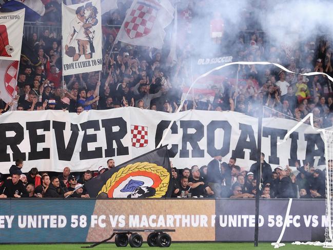 SYDNEY, AUSTRALIA - OCTOBER 01: Sydney United fans enjoy the atmosphere during the Australia Cup Final match between Sydney United 58 FC and Macarthur FC at Allianz Stadium on October 01, 2022 in Sydney, Australia. (Photo by Cameron Spencer/Getty Images)