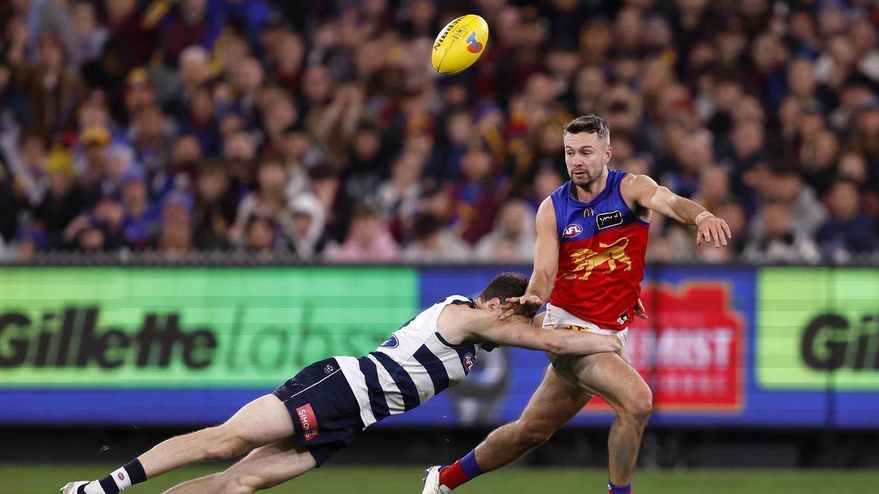 Brisbane Lions sub Conor McKenna (right) tries to evade the tackle of Geelong’s Jeremy Cameron during Brisbane’s preliminary final win. Picture: Darrian Traynor/AFL Photos/via Getty Images