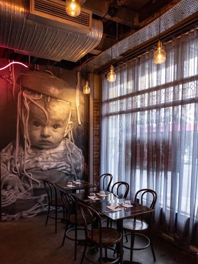 Quirky artwork lines the walls at Mi Raak, Fortitude Valley. Picture: David Kelly