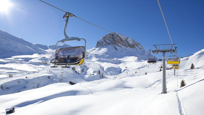 Ski lift in wonderful winter landscape, Dolomites. Credit: Istock