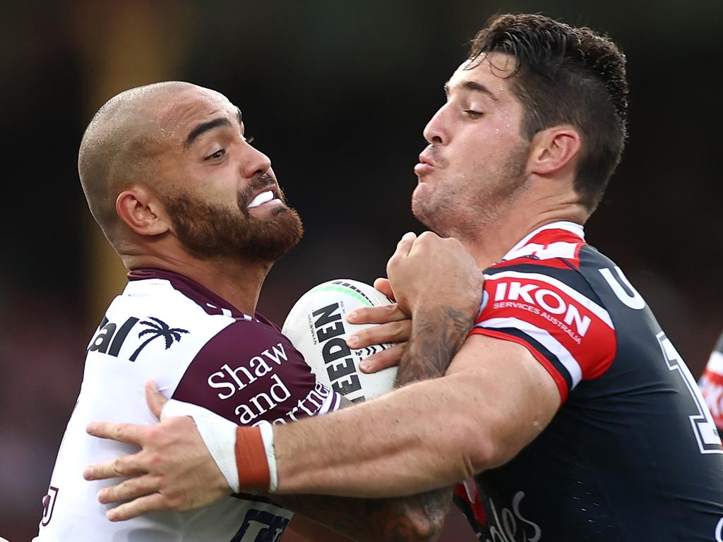 SYDNEY, AUSTRALIA - MARCH 13:  Dylan Walker of the Sea Eagles is tackled Nat Butcher of the Roosters during the round one NRL match between the Sydney Roosters and the Manly Sea Eagles at the Sydney Cricket Ground, on March 13, 2021, in Sydney, Australia. (Photo by Cameron Spencer/Getty Images)