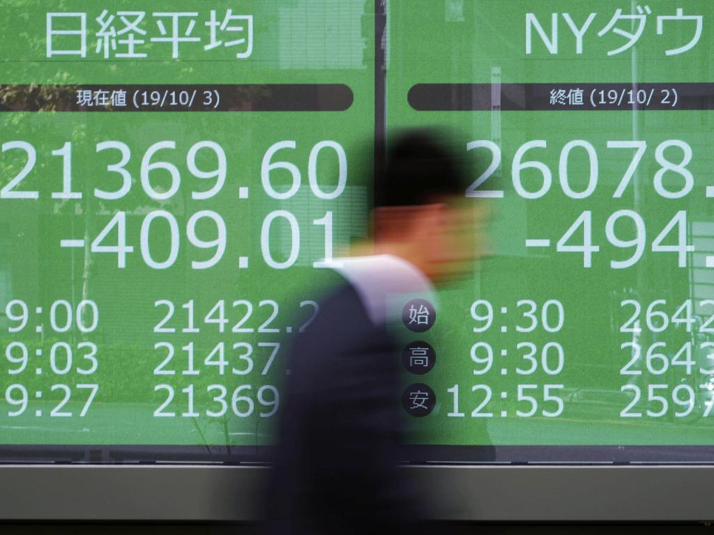 Asian stocks fell for a fourth day on Thursday as weaker US manufacturing and hiring data fuelled jitters about the global economy. Picture: AP Photo/Eugene Hoshiko