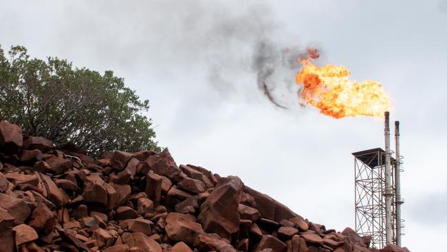 Activists and some scientists argue that industrial emissions on the Burrup Peninsula are damaging nearby ancient rock art. Credit: Save our Songlines