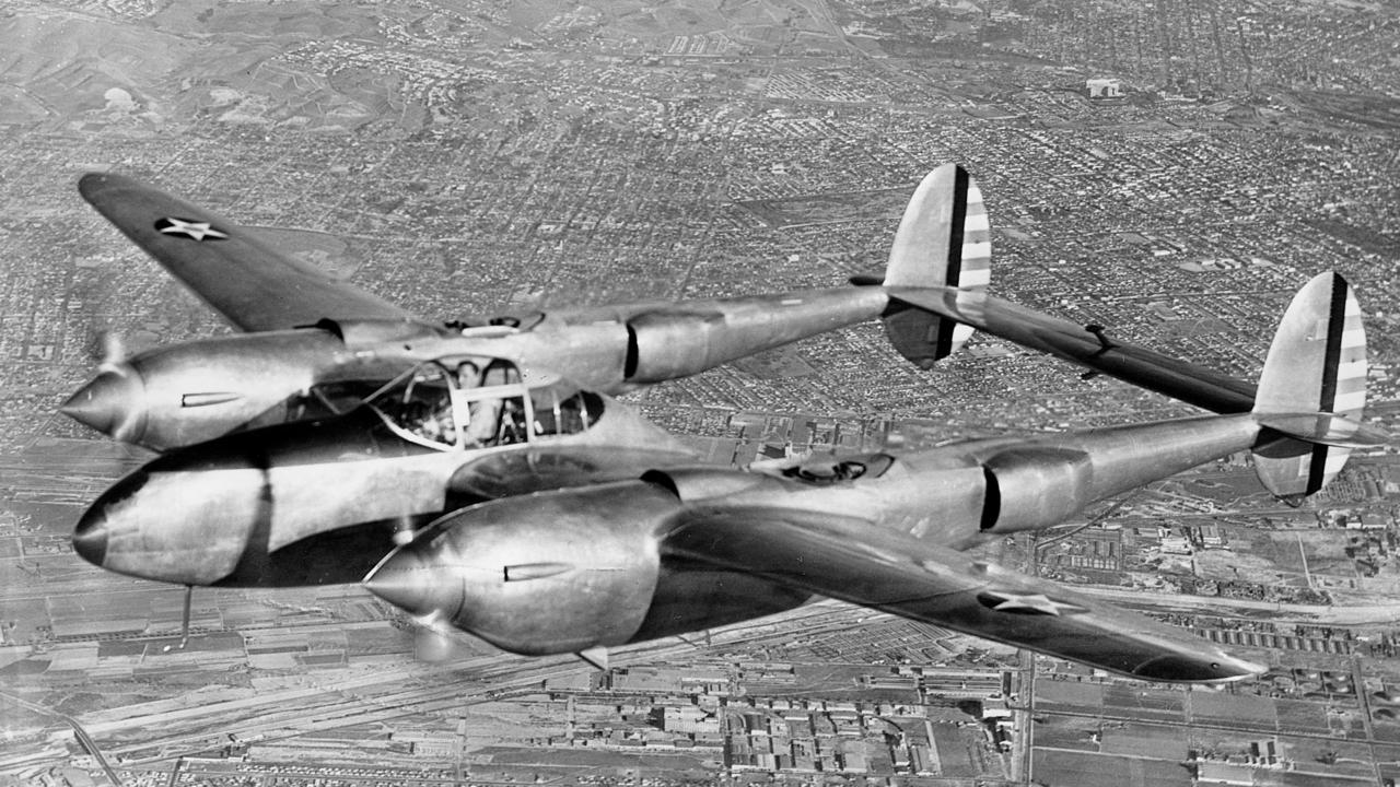 A Lockheed P-38 Lightning twin-engine fighter, which was used during World War II, flies over Los Angeles in 1940.