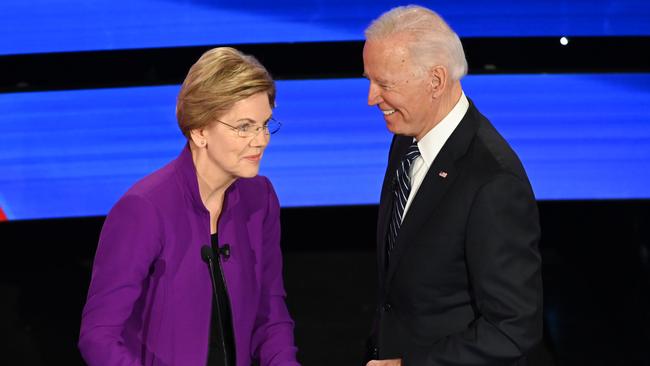 The CFPB was the brainchild of Elizabeth Warren. The Massachusetts senator and former Vice President Joe Biden during a break in a Democratic presidential primary debate in January. Picture: AFP