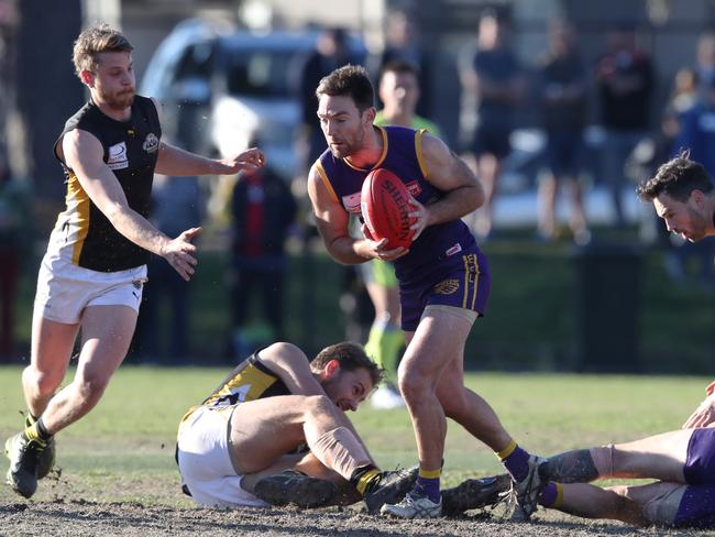 Adam Parker emerges with the ball. Picture: David Crosling