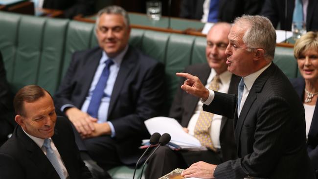 Then-Prime Minister Tony Abbott (left) watches on as Malcolm Turnbull speaks in Question Time in 2014. Photo: Gary Ramage