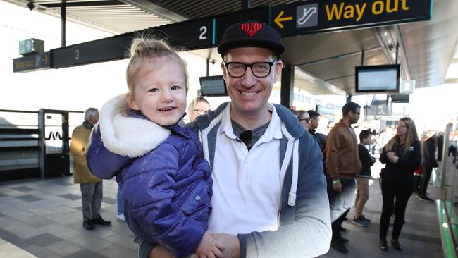 Todd Smithson and daughter Adeline, 2, as the train arrives at the station. Picture: David Swift