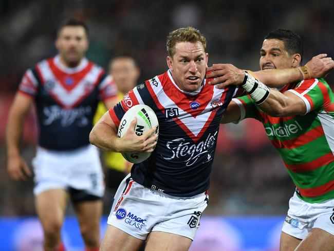 Roosters second-rower Mitchell Aubusson fends off South Sydney's Cody Walker in an NRL game last season. Both are Northern Rivers products. Photo Joel Carrett