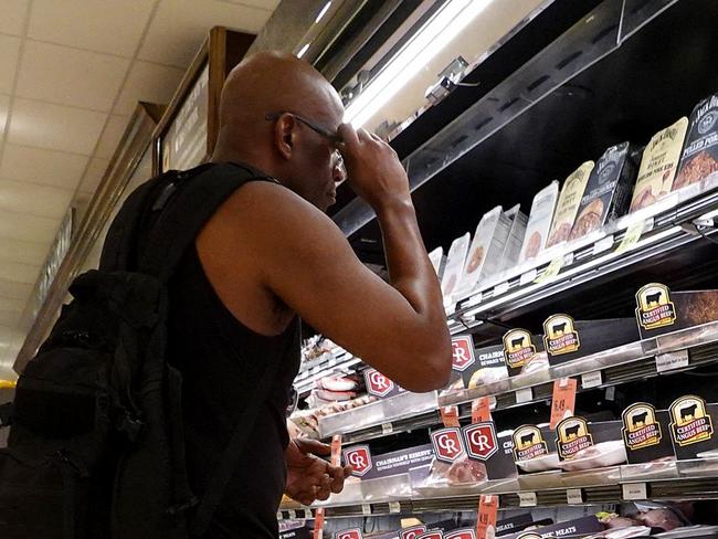 MIAMI, FLORIDA - JULY 12: A shopper makes their way through a grocery store on July 12, 2023 in Miami, Florida. The U.S. consumer price index report showed that inflation fell to its lowest annual rate in more than two years during June.   Joe Raedle/Getty Images/AFP (Photo by JOE RAEDLE / GETTY IMAGES NORTH AMERICA / Getty Images via AFP)