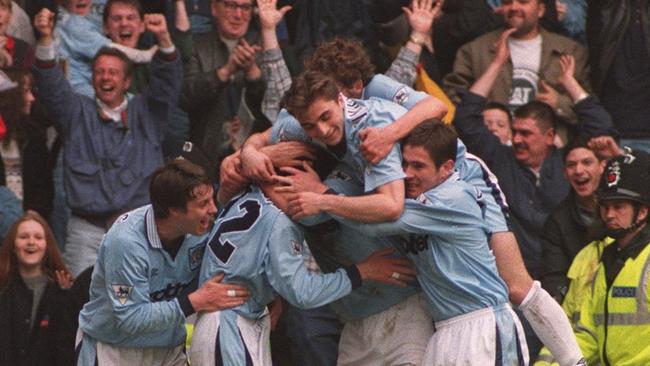 Manchester City celebrate after Mikhail Kavelashvili scores the equaliser in their match against Manchester United in April 1996. Picture: Getty