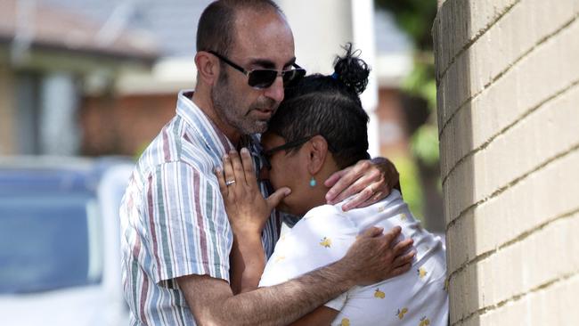 Friend and neighbour Marie Groves is comforted by her partner. Picture: NCA NewsWire / Sarah Matray