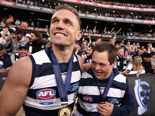 MELBOURNE, AUSTRALIA - SEPTEMBER 24: Joel Selwood of the Cats celebrates with Cats head waterboy Sam Moorfoot after winning the 2022 AFL Grand Final match between the Geelong Cats and the Sydney Swans at the Melbourne Cricket Ground on September 24, 2022 in Melbourne, Australia. (Photo by Cameron Spencer/AFL Photos/via Getty Images)