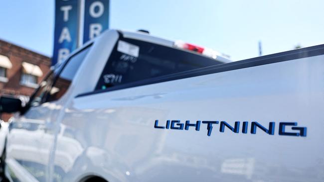 GLENDALE, CALIFORNIA - AUGUST 21: A Ford F-150 Lightning electric pickup truck is displayed for sale at a Ford dealership on August 21, 2024 in Glendale, California. Ford announced it is upending its electric vehicle (EV) strategy for North American vehicles to focus on hybrids, affordability, and longer ranges.   Mario Tama/Getty Images/AFP (Photo by MARIO TAMA / GETTY IMAGES NORTH AMERICA / Getty Images via AFP)