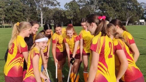 Team spirit is strong with Moreton Bay College (MBC) hockey sides against Brisbane Girls Grammar School. Picture: MBC
