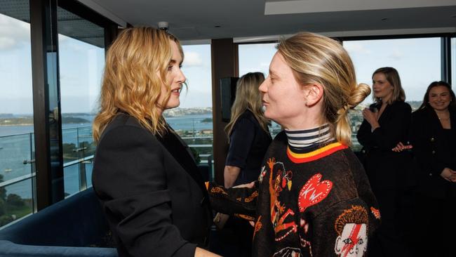 Australian actress Mia Wasikowska embraces Winslet. Picture: Caroline McCredie