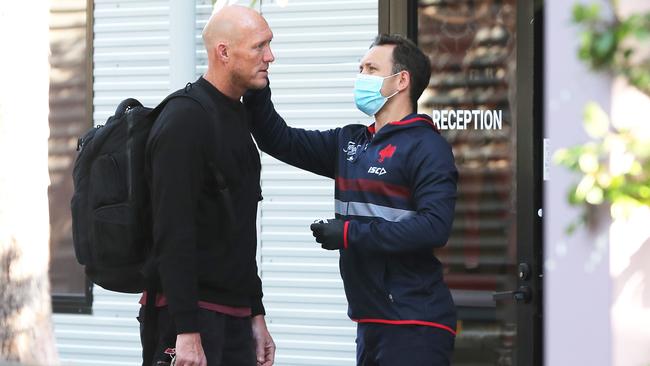 Roosters assistant coach Craig Fitzgibbon gets his temperature checked before training. Picture: Matt King/Getty Images