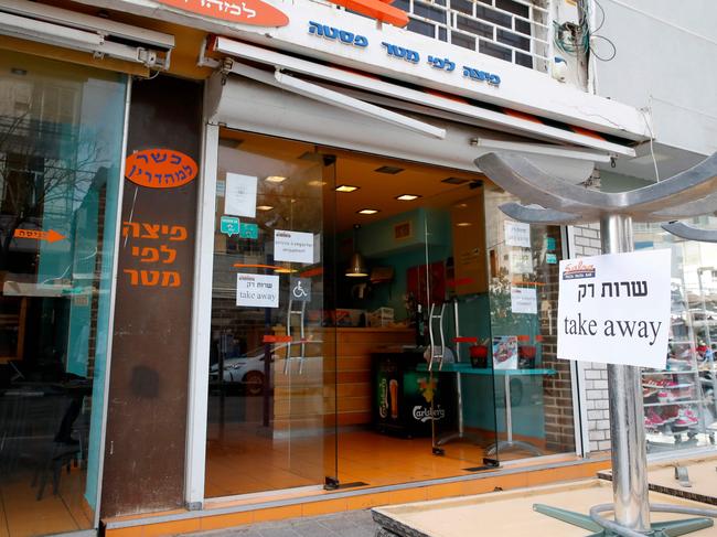 A picture from the central coastal city of Netanya shows a shop serving only takeaway. Picture: AFP