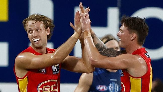 DARWIN, AUSTRALIA - MAY 16: Jack Lukosius (left) and Bailey Humphrey of the Suns celebrate during the 2024 AFL Round 10 match between The Gold Coast SUNS and The Geelong Cats at TIO Stadium on May 16, 2024 in Darwin, Australia. (Photo by Michael Willson/AFL Photos via Getty Images)