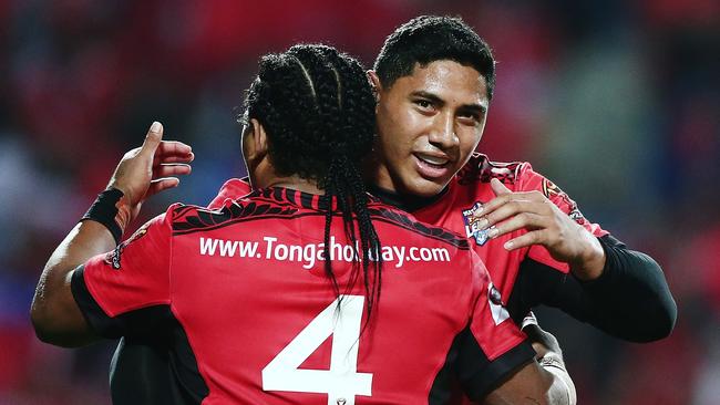 Jason Taumalolo of Tonga celebrates with teammate Solomone Kata.