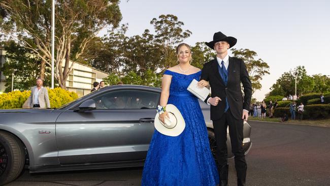 Hannah Thompson (left) and Dylan Booth arrive at Harristown State High School formal at Highfields Cultural Centre, Friday, November 18, 2022. Picture: Kevin Farmer