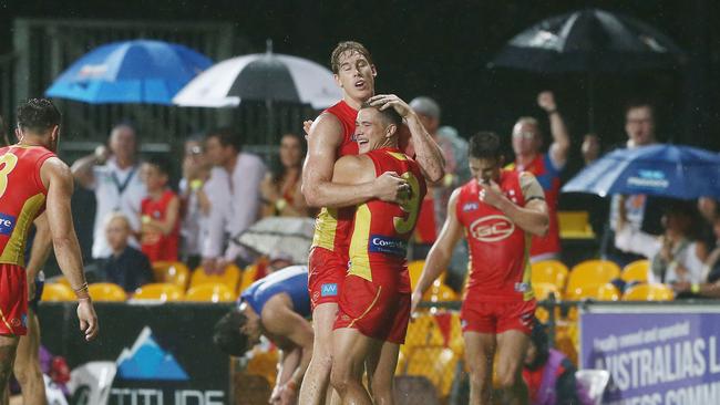 Action from the AFL match between the Gold Coast Suns and the North Melbourne Kangaroos, held at Cazalys Stadium, Cairns. Suns players celebrate at full time. PICTURE: BRENDAN RADKE