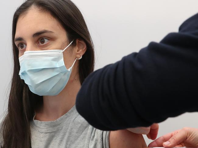 MELBOURNE: Nicole Holmes-30yrs (PH 0400642152) gets her vaccination inside the St Kilda vaccination centre which has opened to 16 to 59yrs for Pfizer. Wednesday, August 25, 2021. Picture: David Crosling