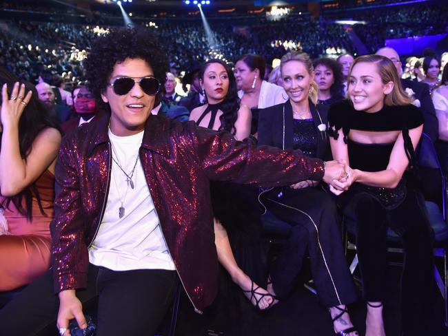 Bruno Mars and Miley Cyrus attend the 60th Annual GRAMMY Awards at Madison Square Garden on January 28, 2018 in New York City. Picture: Getty