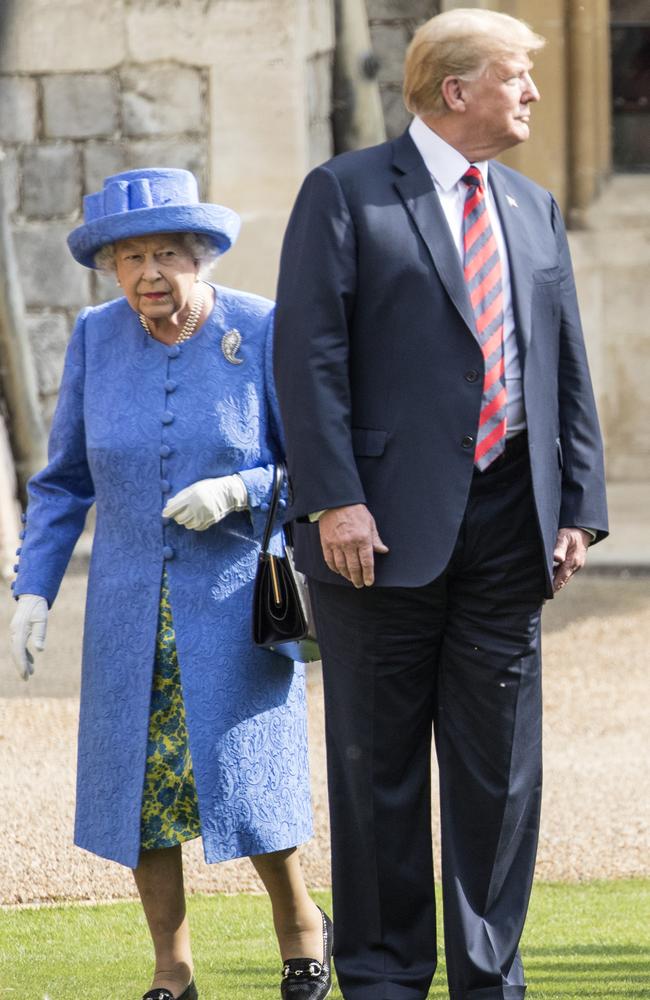 The then-president broke royal protocol by walking in front of the monarch. Picture: Richard Pohle - WPA Pool/Getty Images