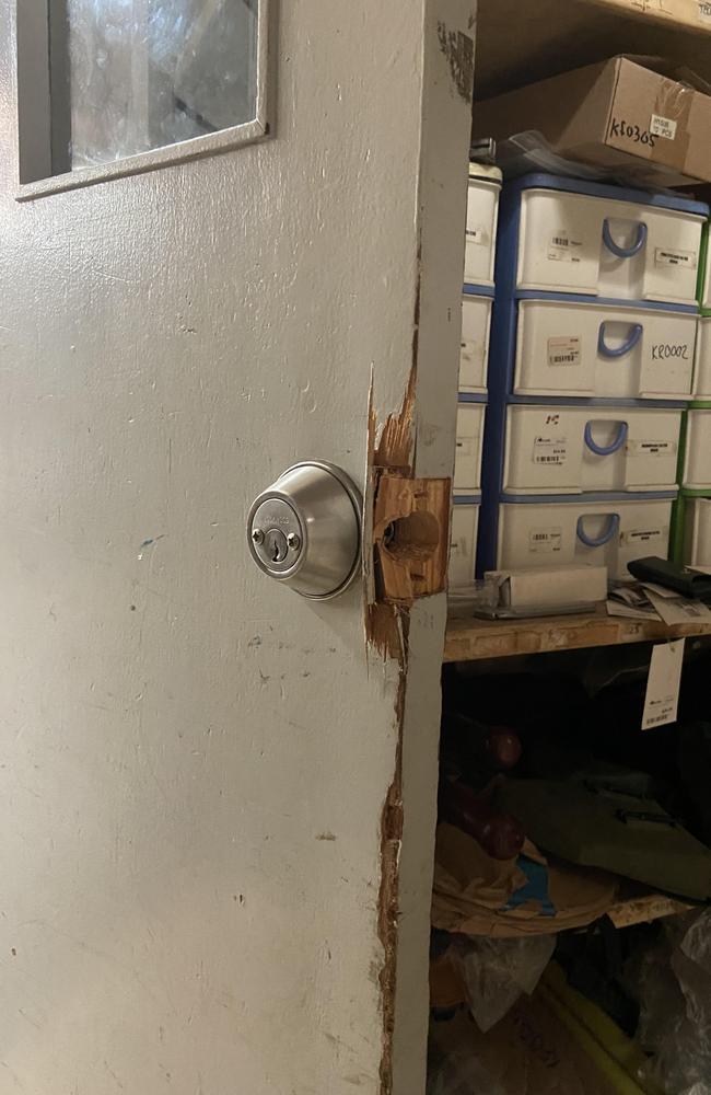 The door to the store’s warehouse area where weapons are kept was “kicked in” during the break-in. Picture: Riley Walter
