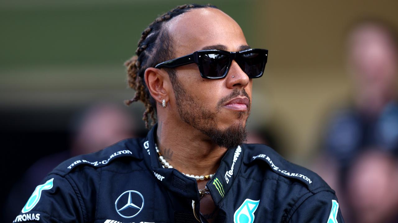 Lewis Hamilton of Great Britain and Mercedes looks on at the Mercedes GP Team Photo during previews ahead of the F1 Grand Prix of Abu Dhabi at Yas Marina Circuit on November 23, 2023 in Abu Dhabi, United Arab Emirates. (Photo by Clive Rose/Getty Images)