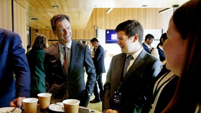 NSW Premier Chris Minns shares a joke with Summit Youth delegate Lachlan Middlemiss at the Youth Breakfast, an opener for the Social Media Summit at ICC Darling Harbour Sydney. Picture: NewsWire / John Appleyard