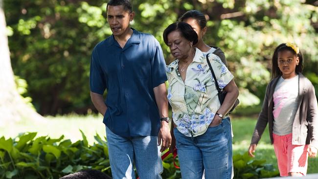 US President Barack Obama walks with his mother-in-law Marian Robinson and his daughters Malia and Sasha in Chicago, Illinois. Picture: Supplied.