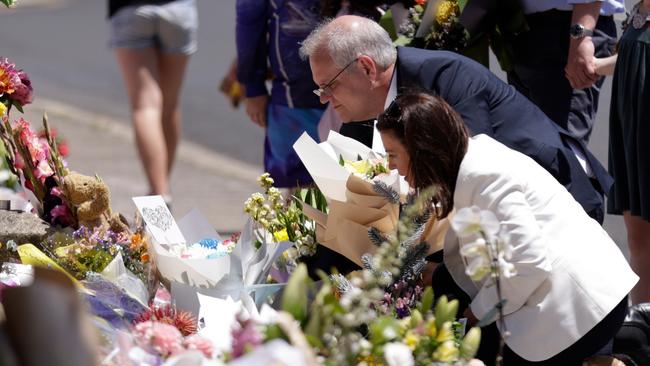 Prime Minister Scott Morrison his wife Jenny lay flowers outside Hillcrest Primary School. Picture: NCA NewsWire / Grant Viney