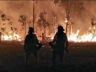 ON THE FRONT LINE: Nicole Moyle captured this photo of two Firefighters on the frontline at Deepwater. Picture: Nicole Moyle