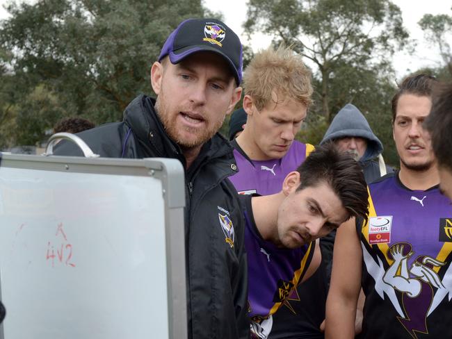 EFL (Div 1): Norwood versus Blackburn at Mullum Reserve, Ringwood. Norwood senior coach Patrick Bowden with players at quarter time.