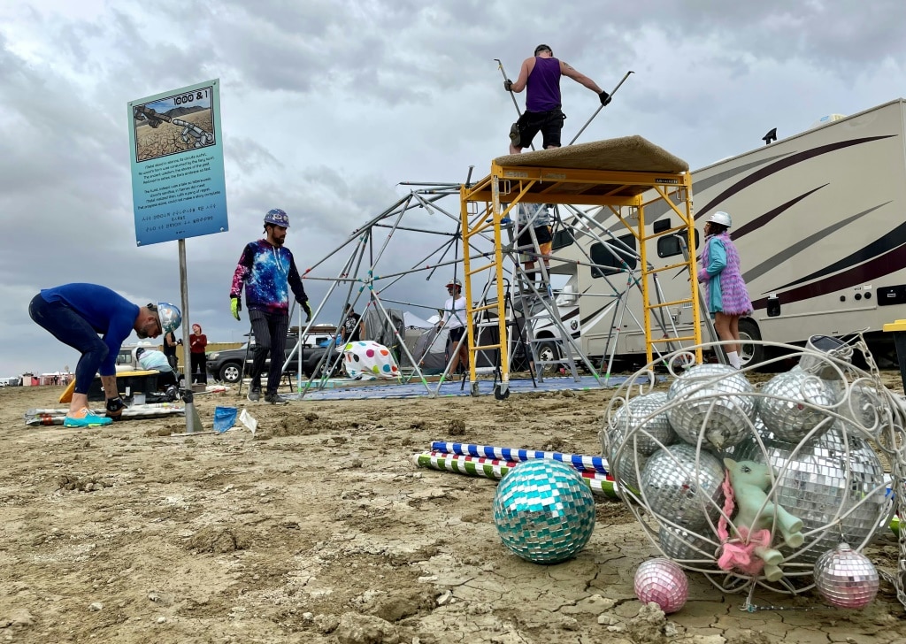 Exodus begins at drenched Burning Man party in US desert