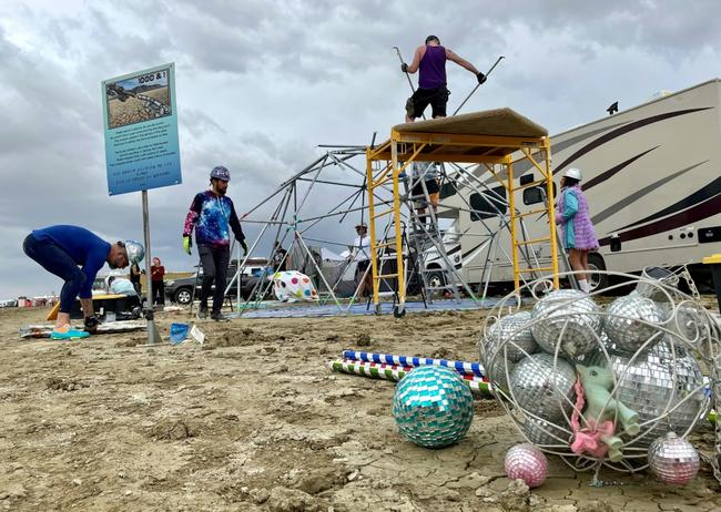 Attendees known as 'burners' strike camp on September 3, 2023, after the annual Burning Man festival site in Nevada's Black Rock desert turned into a mud pit