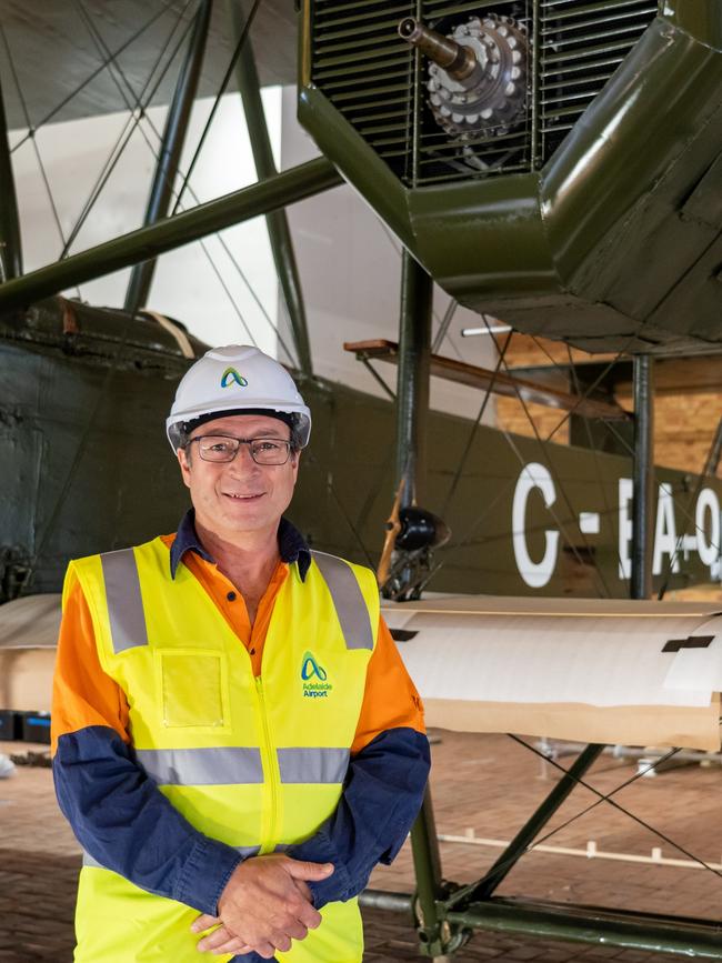 Artlab Australia project manager Ian Miles looking after the dismantling of the Vickers Vimy at the Adelaide Airport. Picture Lev Luo