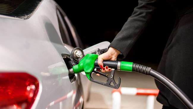 Generic photo - Petrol pump. woman pumping petrol in car at petrol station. Picture: iStock