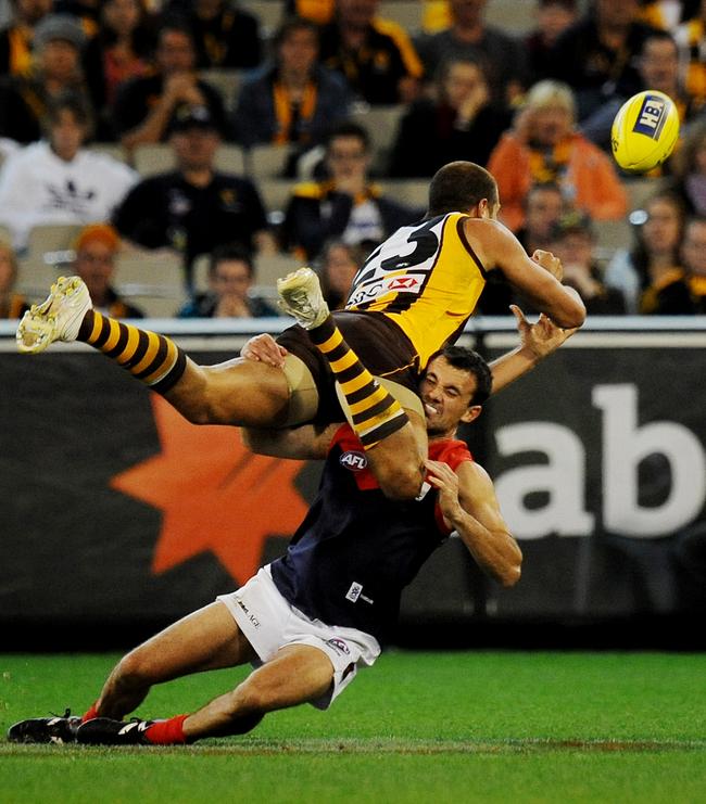 The ‘hard as nails’ Matthew Whelan lays a tackle on Hawthorne’s Lance Franklin