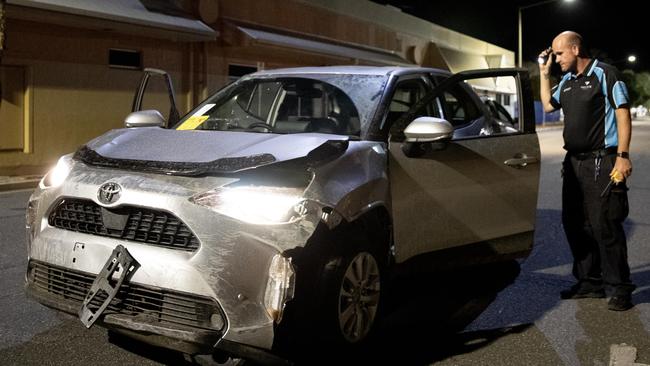 A man inspects a Toyota Yaris Cross allegedly stolen by four Alice Springs youths. Picture: Liam Mendes