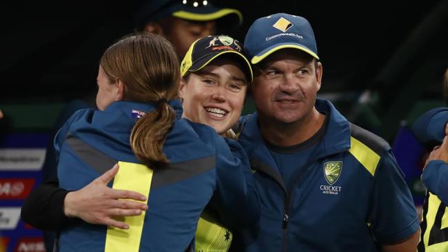 Ellyse Perry and coach Matthew Mott are on top of the world.