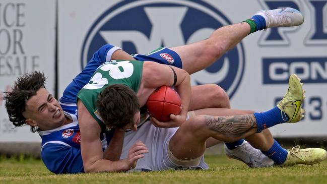 EDFL: East Sunbury’s Kane Vanroosmalen wrapped up by Brody Watts of Sunbury Kangaroos. Picture: Andy Brownbill