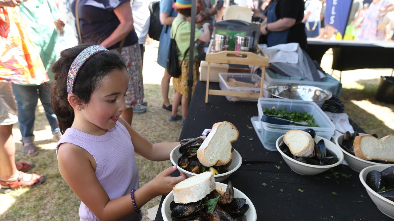 Mila, 6, gets her seafood fix at the Portarlington Mussel Festival. Picture: Mike Dugdale