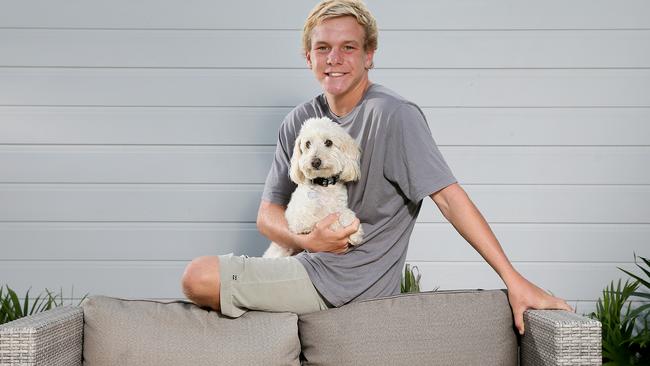 Cooper Westaway, 16, and dog Harvey at his Warriewood home. The Year 10 boy loves meat but can't eat meat any more. He was bitten by a tick at school late last year and then a fortnight later developed an anaphylactic reaction to meat. Picture: Troy Snook