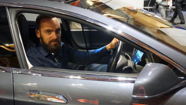 Eveeh founder Slava Kozlovskii in a Tesla Model S