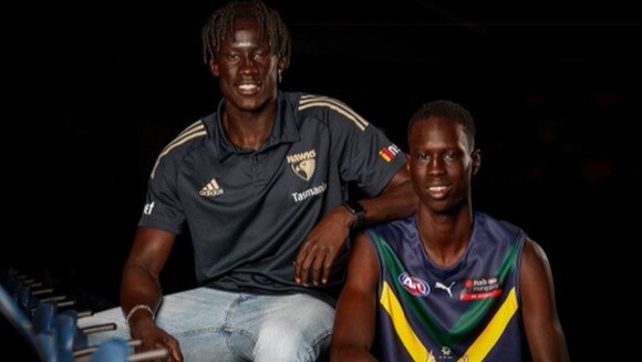 Hawthorn cult figure Changkuoth Jiath with Mac Andrew, who is playing for the Dandenong Stingrays, and rated an exciting prospect.