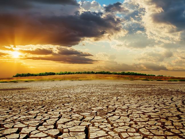 drought earth in sunset. dramatic sky over desert. change climate