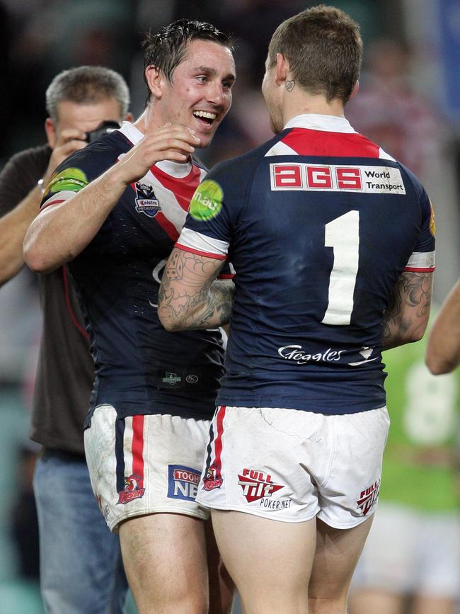 Mitchell Pearce and Todd Carney together after the Roosters beat Carney’s former team, the Raiders, in 2010.